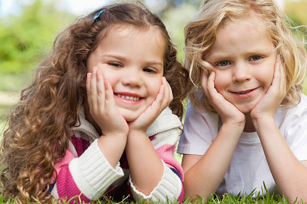 istock Two friends smiling in a park 466266126