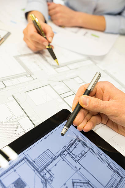 istock Close-up of Team architects working on construction project at office 466266459