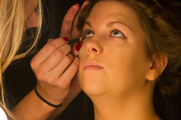 istock Woman applying make up for a bride 466266869
