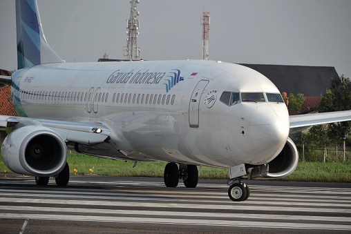 Minsk / Belarus - June 5, 2019: Belarusian airline Belavia plane parked at airport while passengers enter by stairway