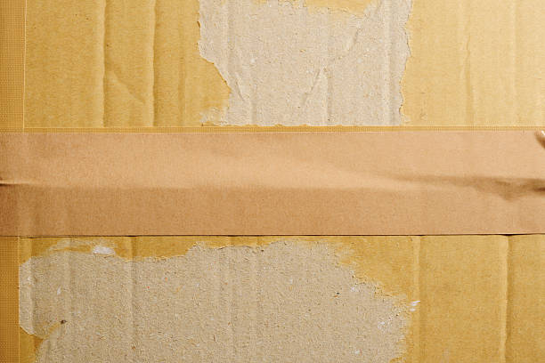 Close-Up of a old cardboard with adhesive tape