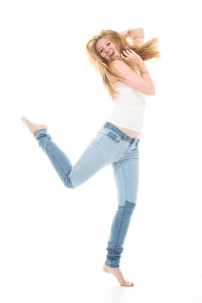 istock Happy blond teenager jumping. 466269912