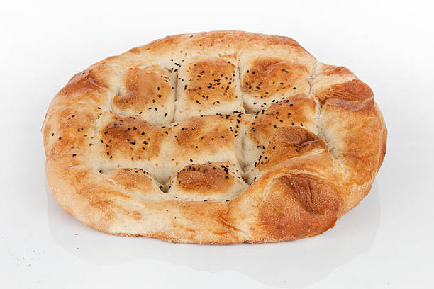 istock Turkish Ramadan Bread pide - Ramazan Pidesi isolated white background 466273224