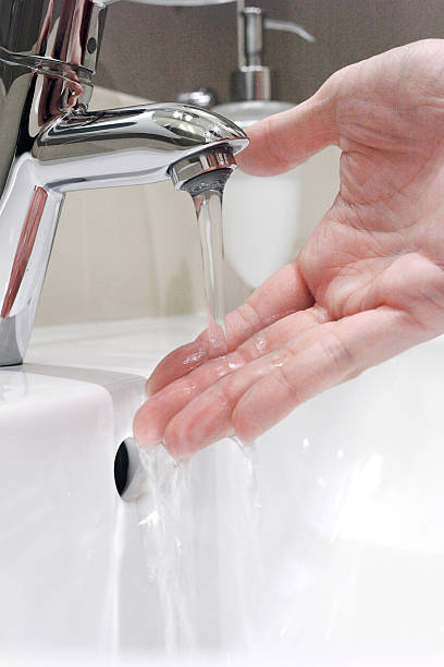 istock Washing arm  in sink bathroom. 466273297