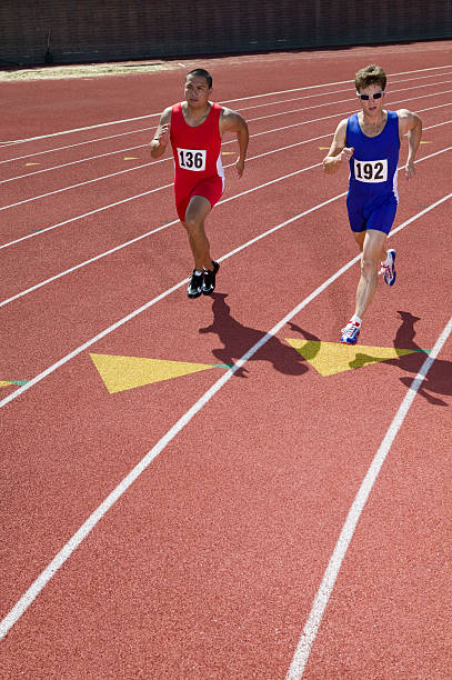 istock Male sprinters running on track 466275104