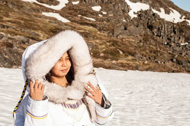 Photo of Inuit Woman on the Tundra of Baffin Island, Nunavut, Canada.