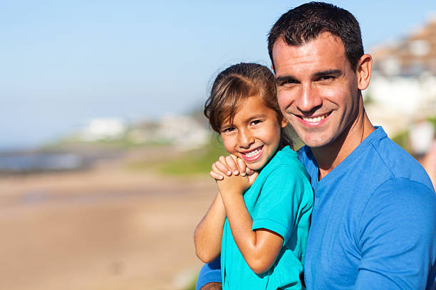istock beautiful and father at beach 466279803