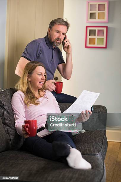 Querying A Bill Stock Photo - Download Image Now - Couple - Relationship, UK, 2015