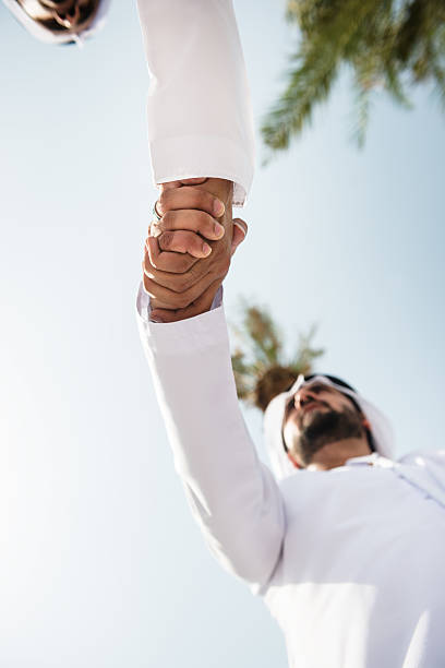 istock sheikh doing a deal in UAE 466281764
