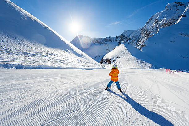 istock Boy on ski-track skiing view from back in Sochi 466282120