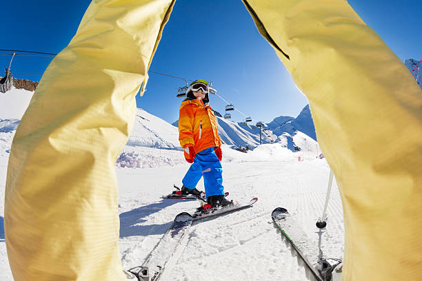 istock Skiing boy view between the legs of grown-up 466282126
