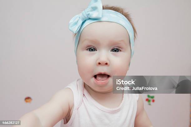 Beautiful Baby With Blue Eyes Opened Her Mouth Stock Photo - Download Image Now - 12-23 Months, 6-11 Months, Babies Only