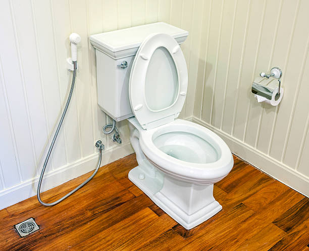 istock Clean, white and sterile toilet in a white wall bathroom. 466282640