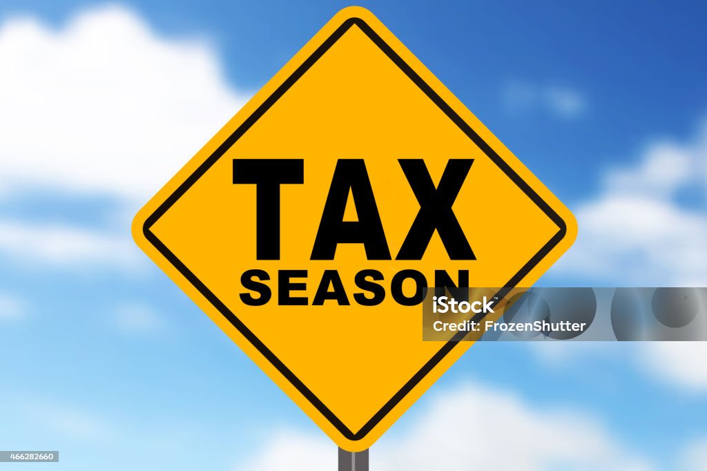 Tax sign with blue sky in the background 2015 Stock Photo