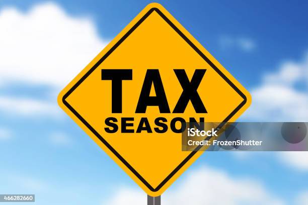 Tax Sign With Blue Sky In The Background Stock Photo - Download Image Now - 2015, Horizontal, No People