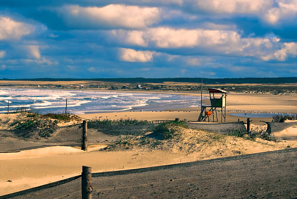 Lifeguard tower Amazing view of a lifeguard tower standing on a beach in Cabo Polonio at sunset cabo polonio stock pictures, royalty-free photos & images