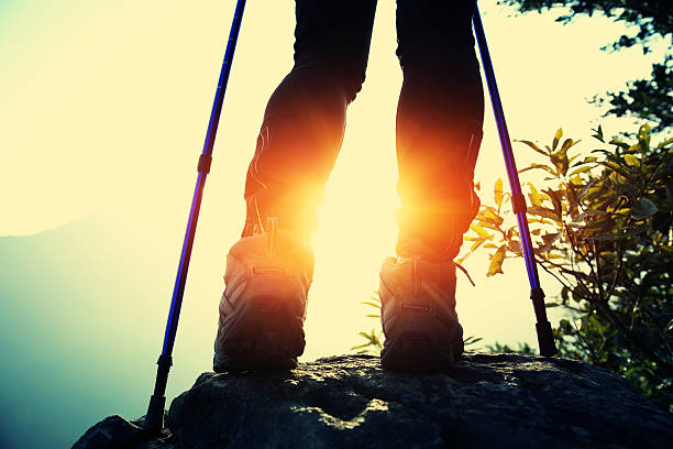 istock hiking legs sunrise mountain peak 466284642