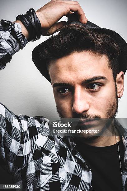 Fashionable Young Adult Posing On Whie Wall Stock Photo - Download Image Now - 18-19 Years, 20-29 Years, 2015