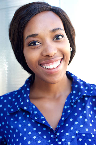 istock Cheerful young woman smiling for camera 466286056