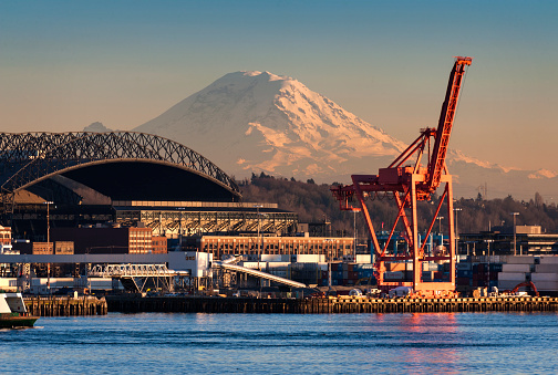 Mt. Rainier looms large over the Port of Seattle on Elliott Bay during a lovely winter sunset.