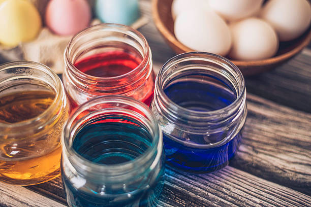 Preparing to dye eggs for Easter. Jars with colored dyes. Preparing to dye eggs for Easter. Jars with colored dyes. food coloring stock pictures, royalty-free photos & images