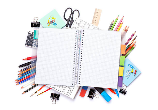 istock Blank notepad over school and office supplies on office table 466287296