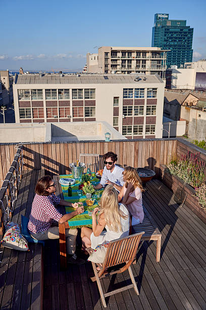 istock Friends party gathering on rooftop 466287616
