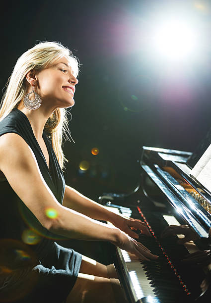 istock Smiling female pianist. 466287746