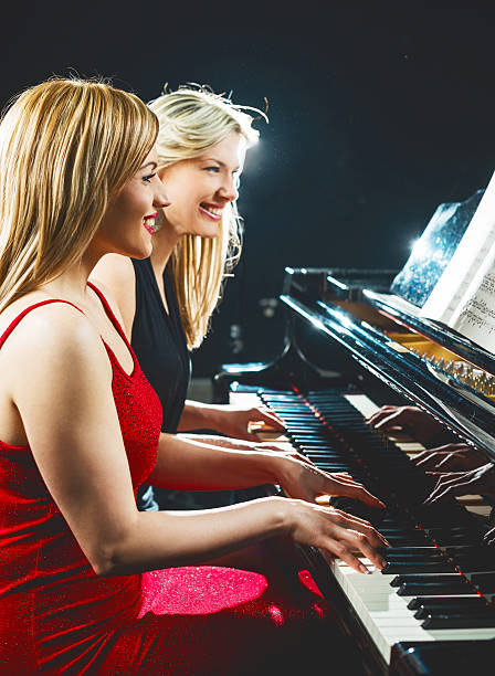 istock Women playing the piano. 466287754