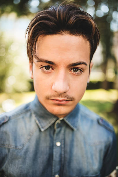 istock fashionable young adult posing serious 466287780