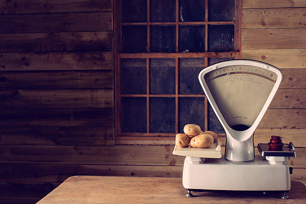 Old, vintage grocers' or butchers' weighing scales from the 1960s or 1970s. Post processed for an old-style look.