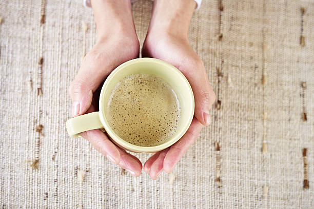 istock hands holding cup of coffee 466288892