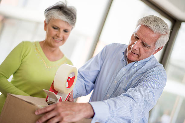 istock Senior couple packing in boxes 466290724