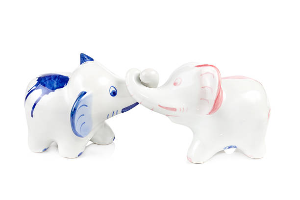 istock Ceramic enamelled statuette of white elephant on white background 466291998