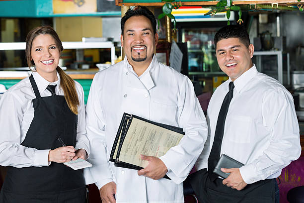 istock Waitress, chef, and manager in family owned Tex-Mex restaurant 466293454