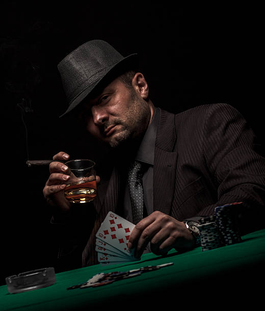 istock Gambler shows royal flush in his hand. 466293656
