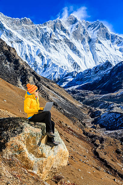 istock Young woman using laptop in Himalayas, Nepal 466293700