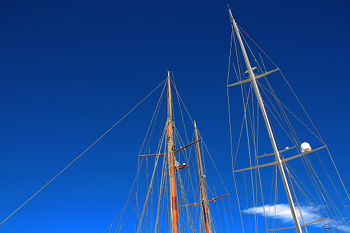 Sail masts on blue sky
