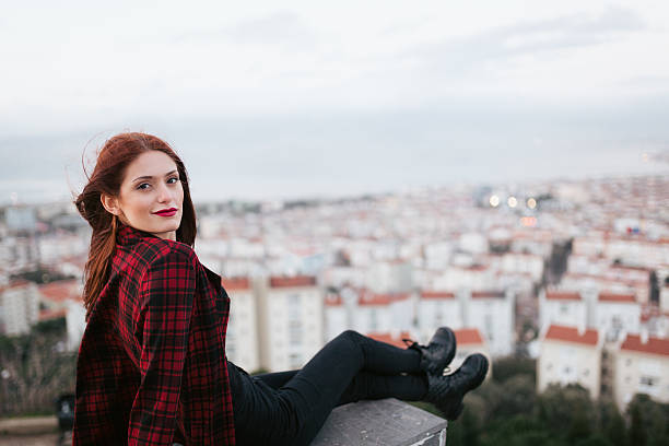 istock Young woman looking camera in urban landscape 466294484