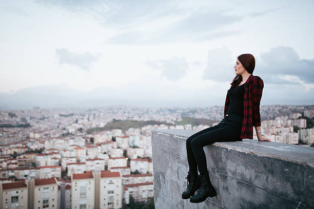 istock Young woman looking away - city life 466294702