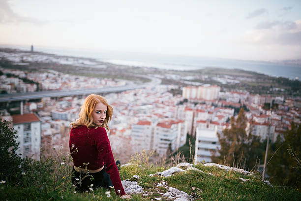 istock Young woman looking at camera in urban landscape 466294840