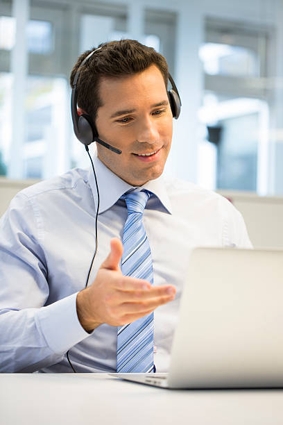 istock Businessman at office on the phone with headset, Skype 466298055