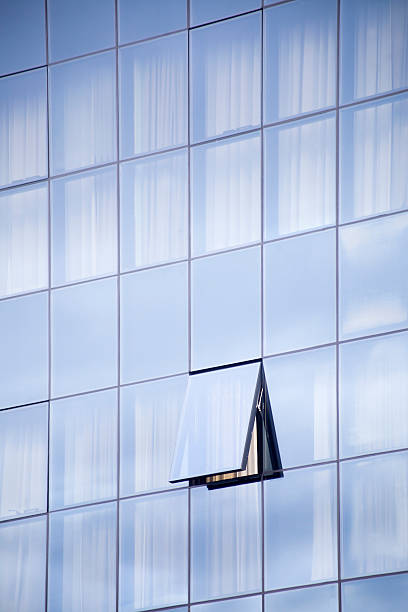 istock Glass building facade with one open window. 466301318