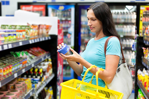 istock woman buys canned 466301604