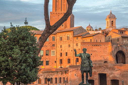 Julius Caesar bronze statue in Rome, golden hour