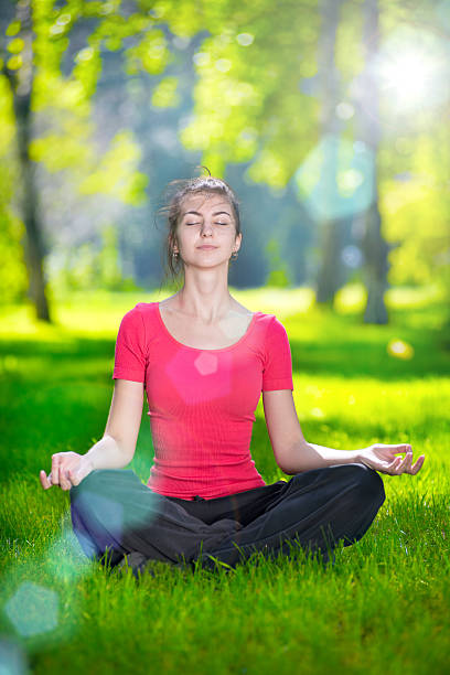 istock Young woman doing yoga exercises 466304812