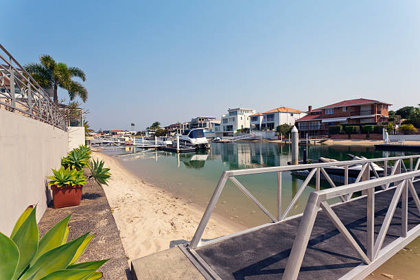 istock lake and pier behind modern australian mansion 466305147