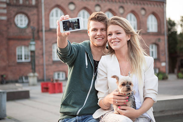 istock Young couple walking with their dog. 466306926