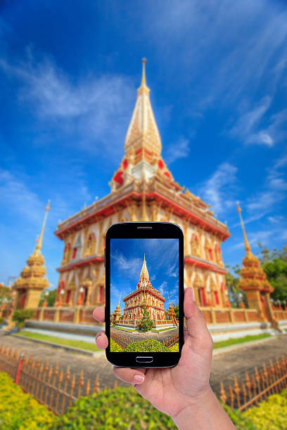 istock Hand holding smartphone isolated on white background 466306934
