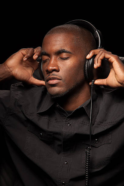 istock Man Enjoying Music Through Headphones 466309566